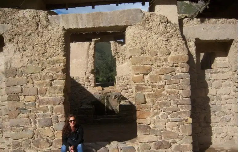 Quiet moment inside ancient Cusco ruins surrounded by centuries of history. 